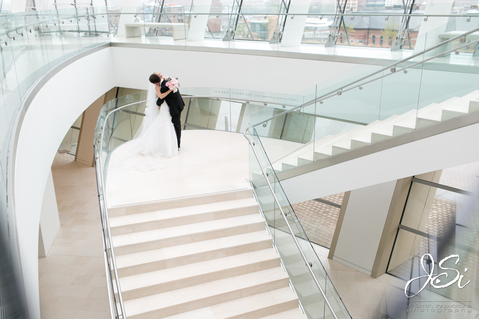 Kansas City Kauffman Center for the Performing Arts wedding first look husband wife photographer team photo