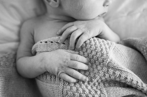 cute adorable newborn baby hands and fingers photo