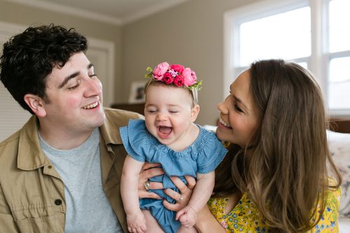 authentic real moment of happy family at in home family portrait session picture