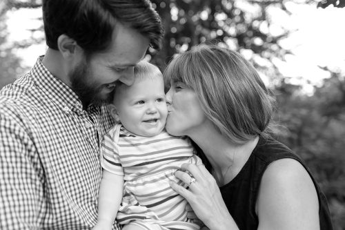 sweet baby kisses black and white family photographer copy