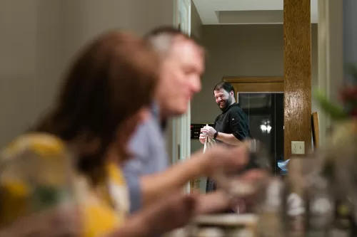 Kansas City documentary photographers birthday dinner chef smiling authentic moment picture