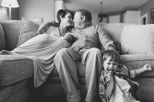 Kansas City lifestyle in-home newborn photographers cute boy being goofy