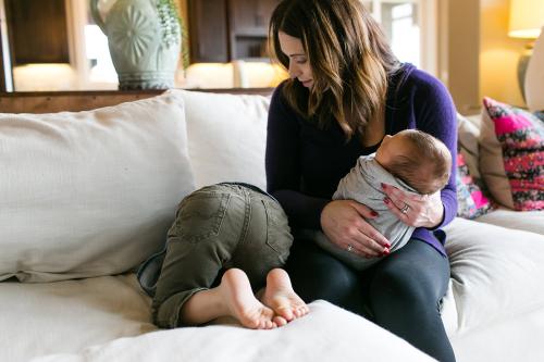 Kansas City real life moments documentary newborn photographer boy mooning camera