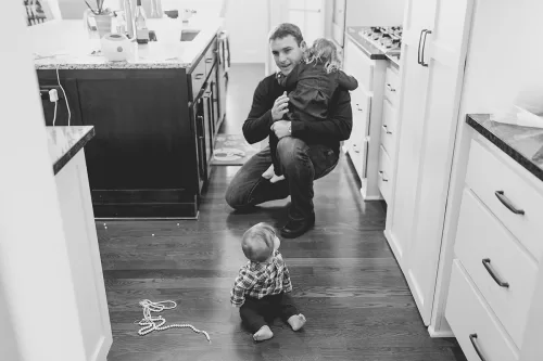 birthday party kid with juice box looking up at ballon artist authentic funny moment