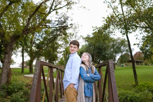 fun ornery real moment with brother and sister on bridge