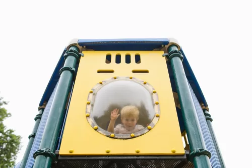 fun photo of kid in playground bubble