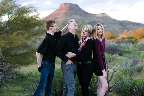 fun silly family picture in desert with mountain in Arizona photo