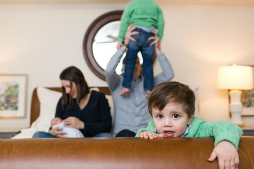 funny candid real life moment during newborn session