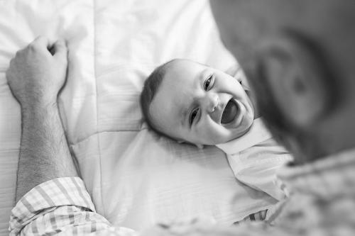 genuine happiness in baby with dad at home family pictures session picture