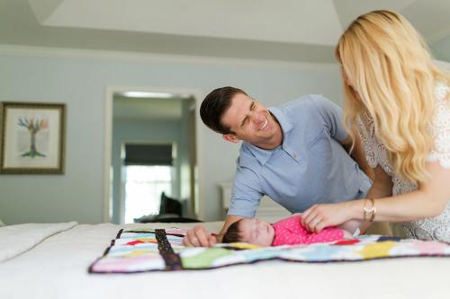 genuine laughing dad during newborn session