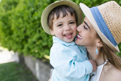 happy real smile of boy with his mom family photo