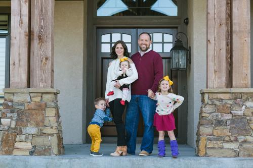 ornery boy mooning camera moment during relaxed at home family photo session