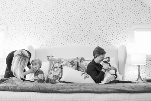 real life feeding newborn wiping toddler face documentary family photo