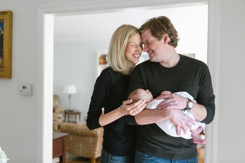 sweet loving real moment of family during lifestyle newborn session picture