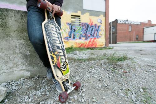 urban graffiti senior with skateboard